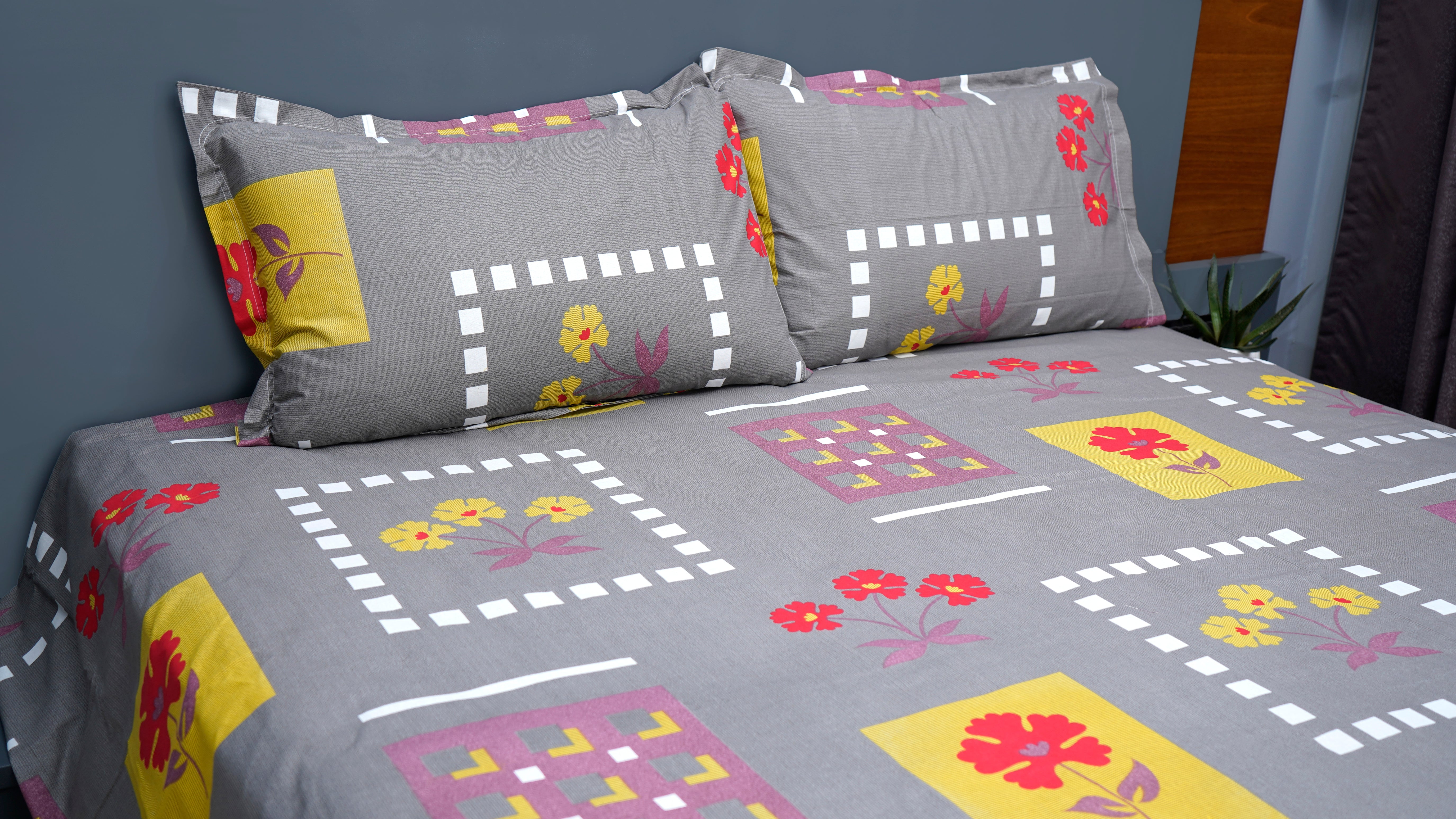 Dark grey with playful red and yellow flowers double bedsheet with pillow covers