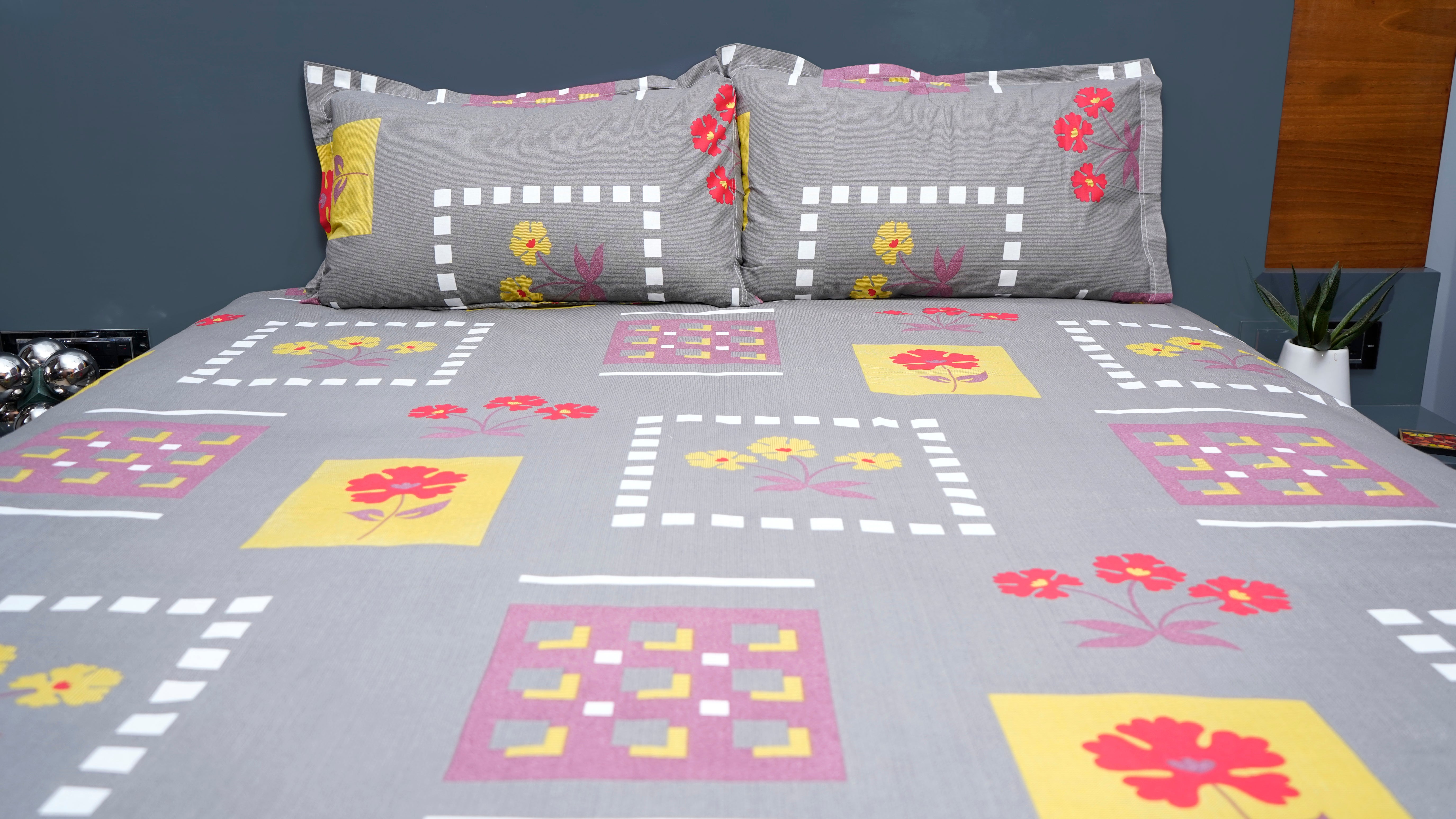 Dark grey with playful red and yellow flowers double bedsheet with pillow covers