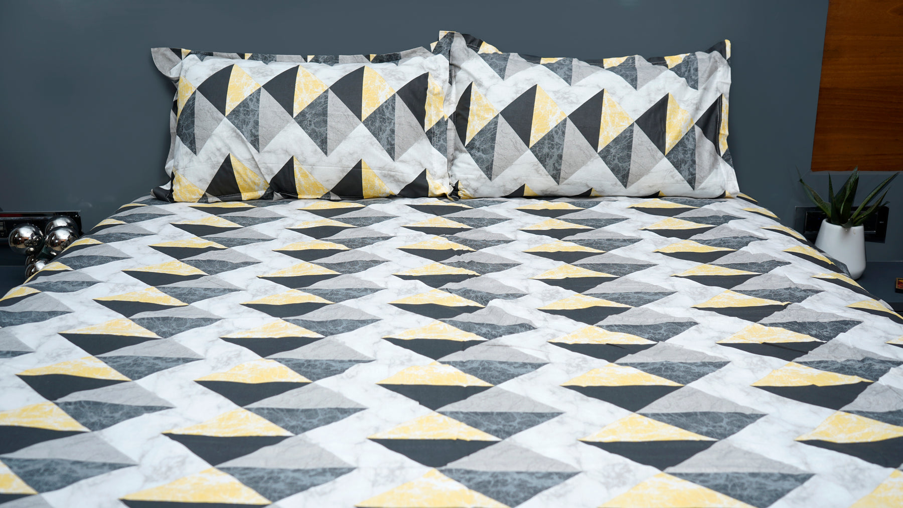 Black and yellow shaded triangular print double bedsheet with pillow cover