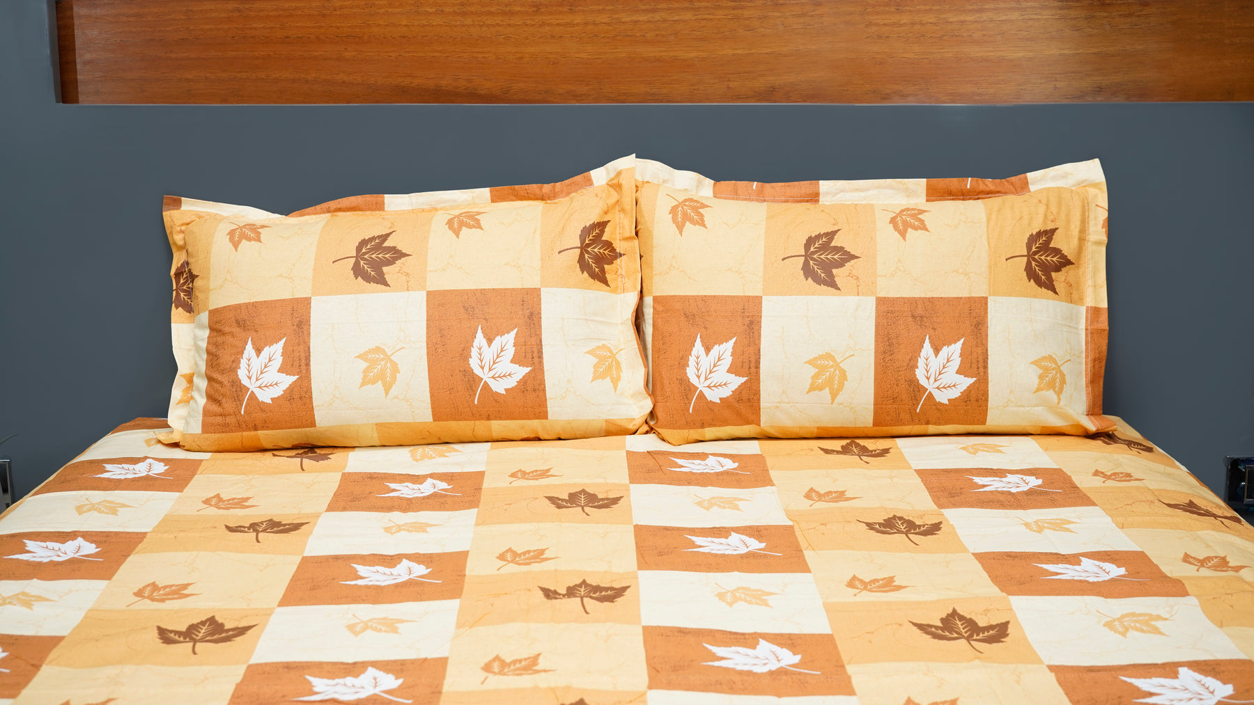 Brown shaded checks with maple prints double bedsheet with pillow covers