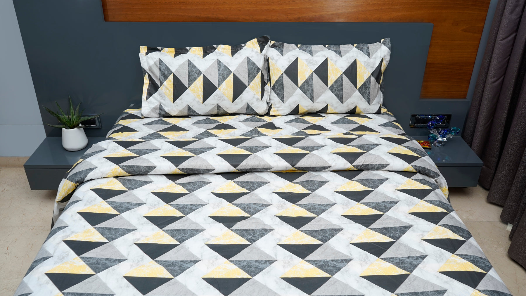 Black and yellow shaded triangular print double bedsheet with pillow cover