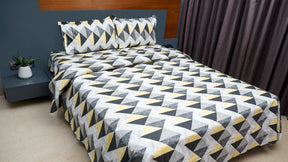 Black and yellow shaded triangular print double bedsheet with pillow cover